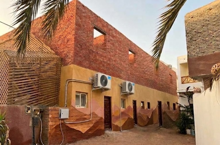 Brick, lattice and palms in the courtyard